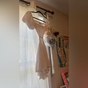 White Isabelle’s cabinet cutout mini dress. So cute bought from a boutique.